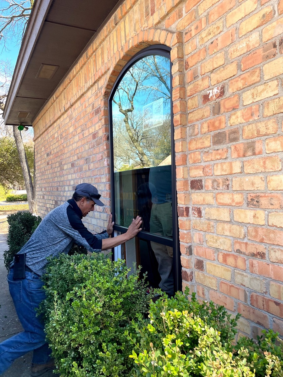 A-man-installing-energy-efficient-replacement-windows-in-Greensburg-Pennsylvania